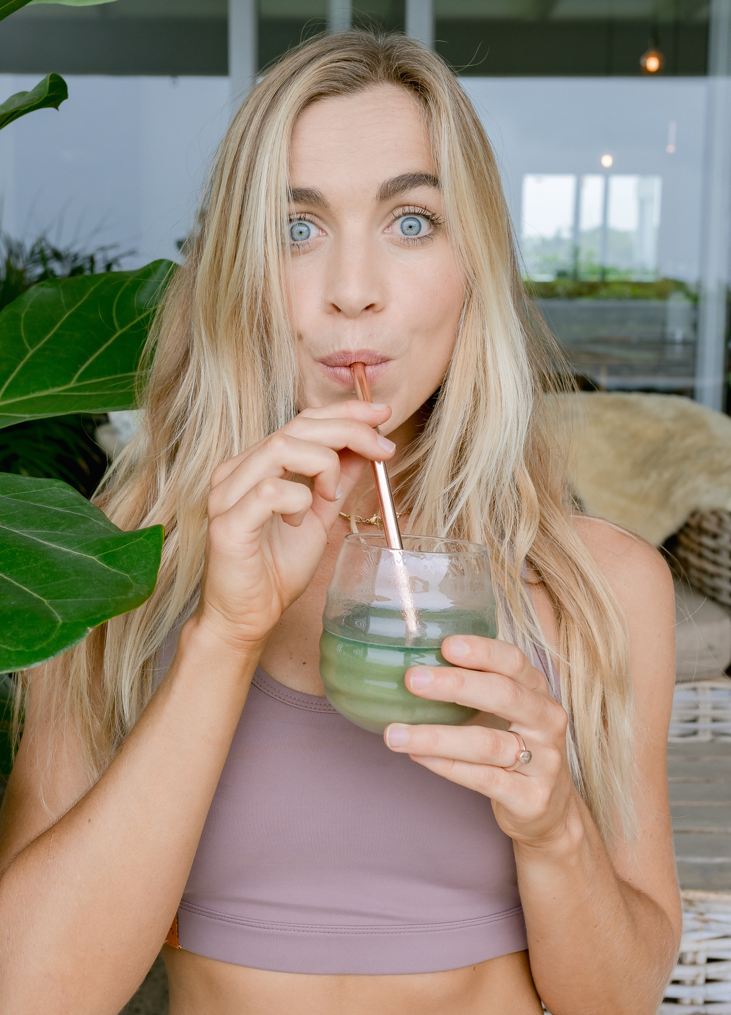 Blonde_Woman_Drinking_Greens_Powder_Garden_Setting_Patio