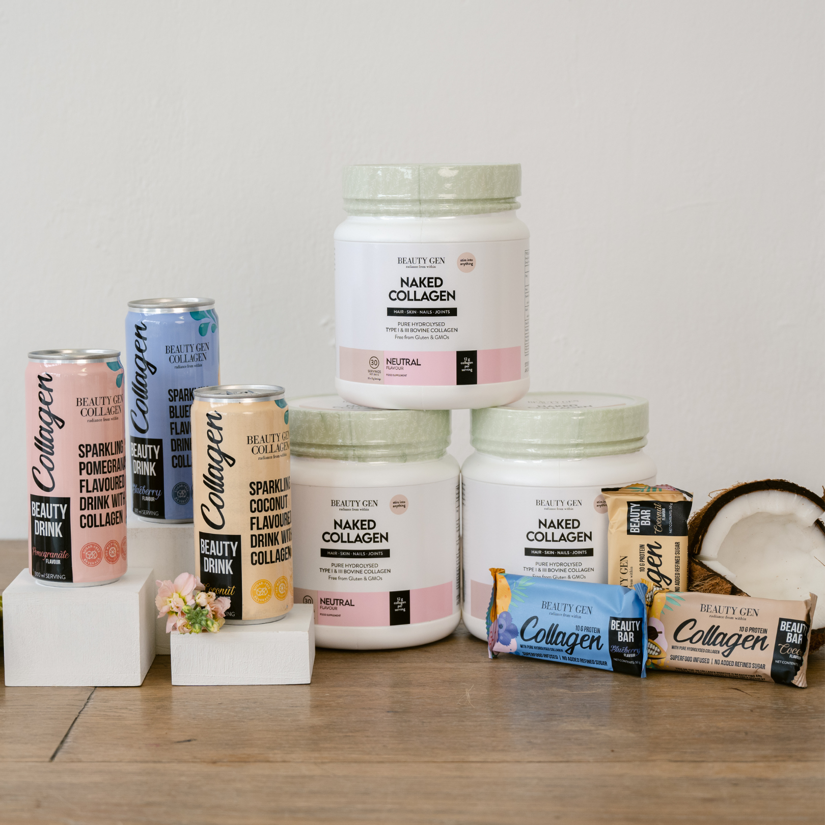 Collection of Beauty Gen collagen products on a wooden surface with a neutral background