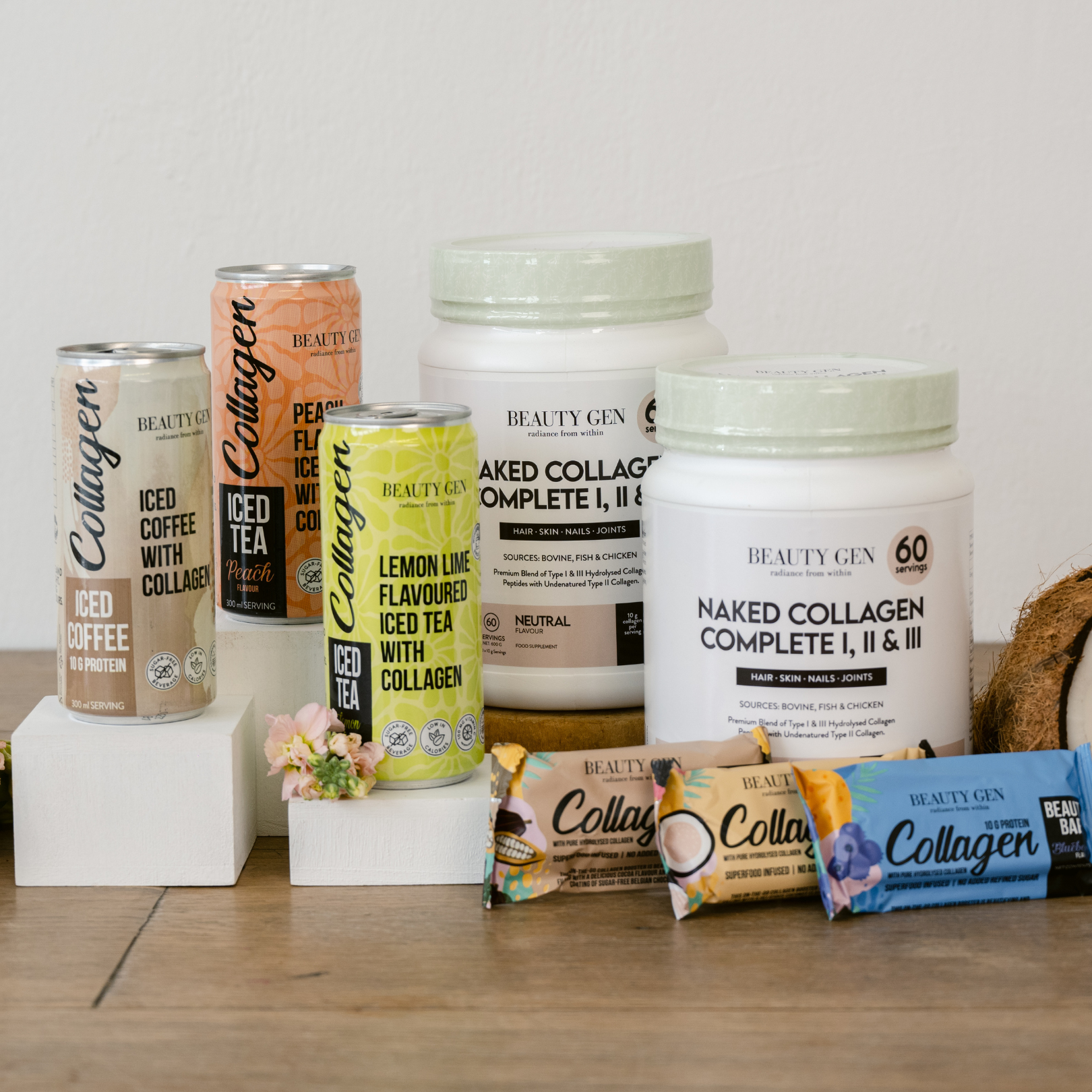 Collection of Beauty Gen collagen products on a wooden surface with a white background