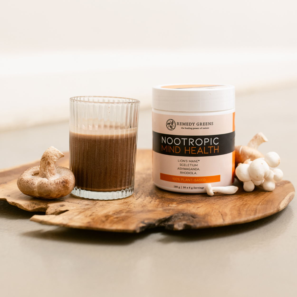 Nootropic Mind Health with glass of mixed Nootropic and mushrooms