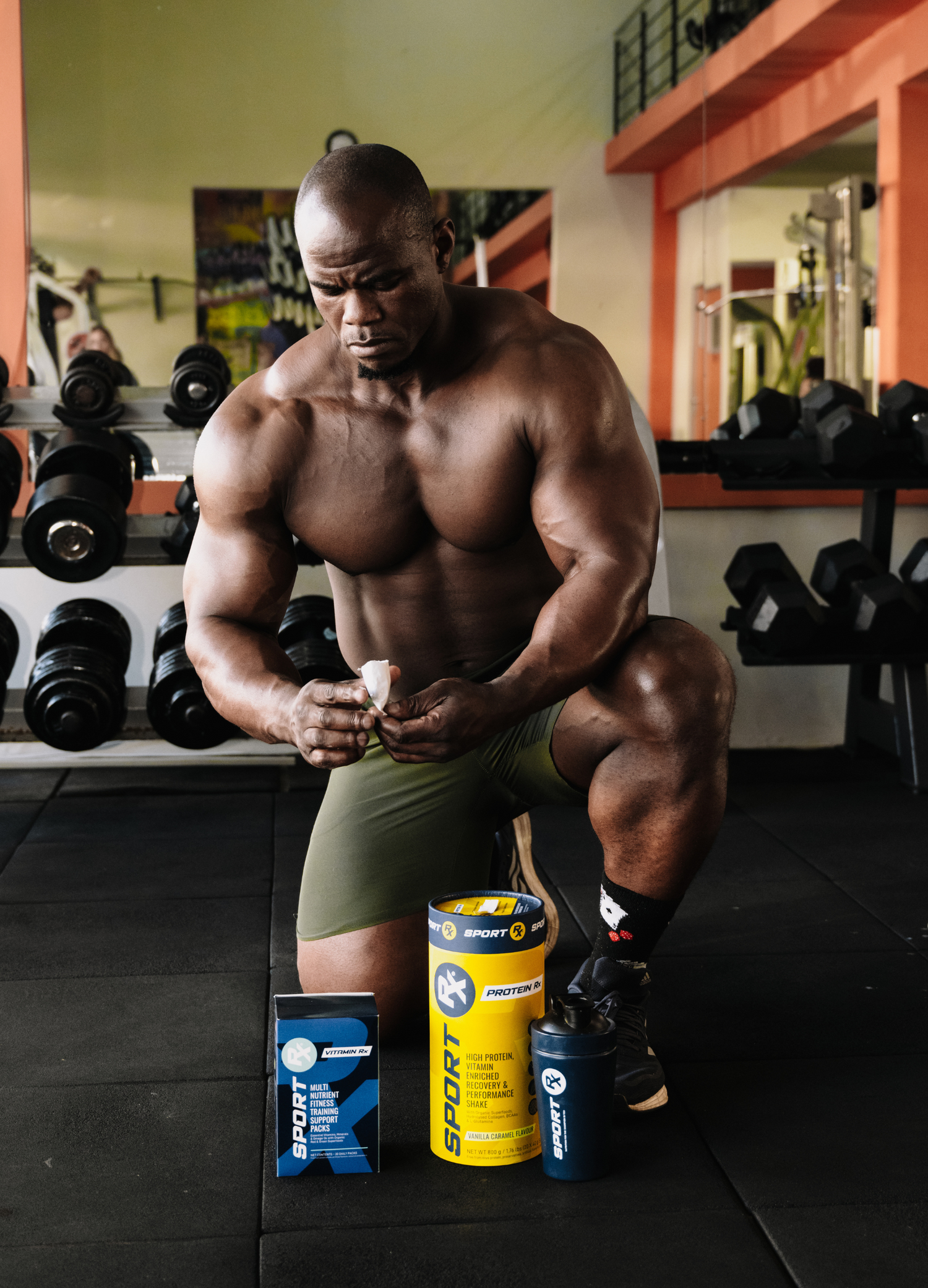 SPORT_Rx_athlete_with_PROTEIN_Rx_and_VITAMIN_Rx_products