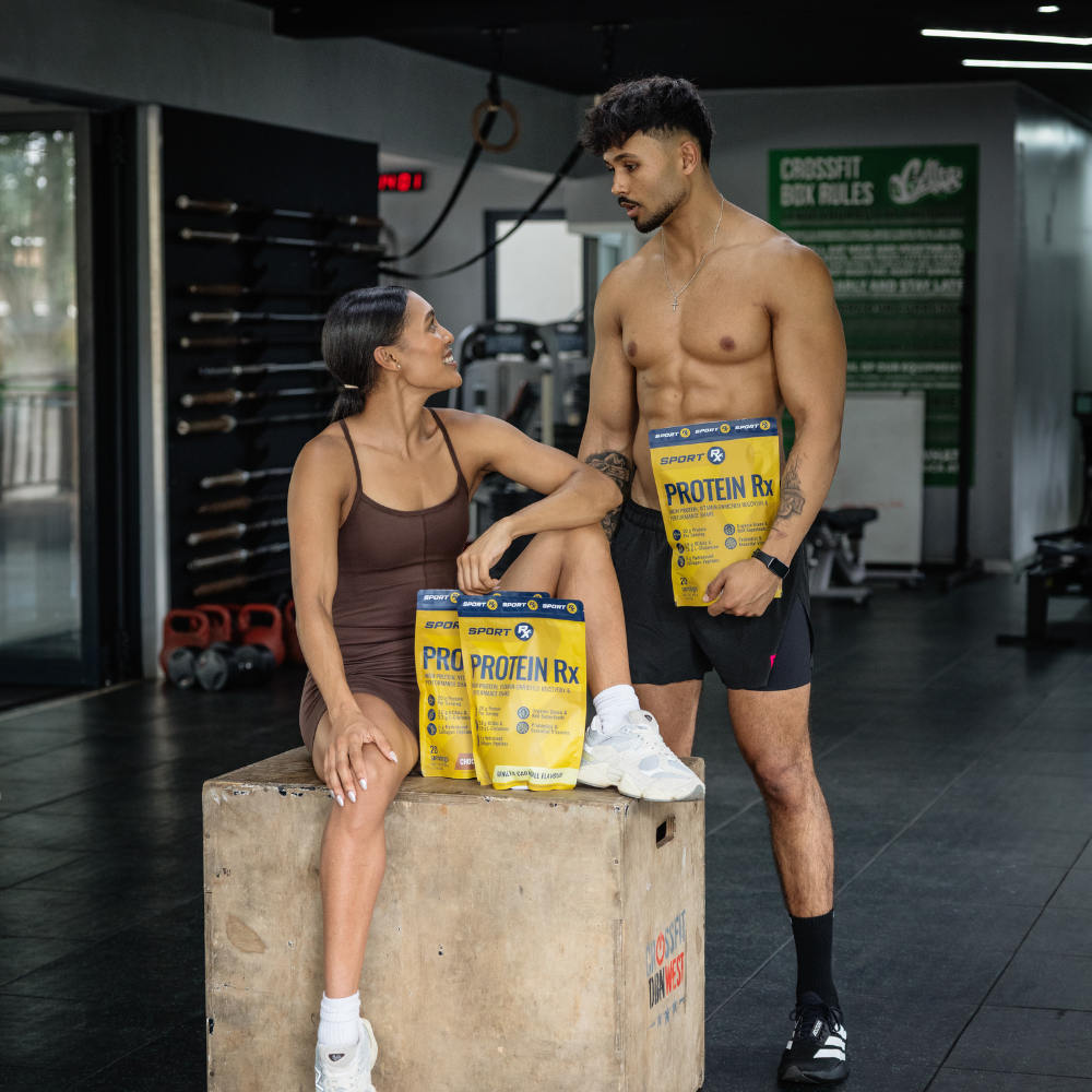Two people in a gym setting with Protein Rx packaging