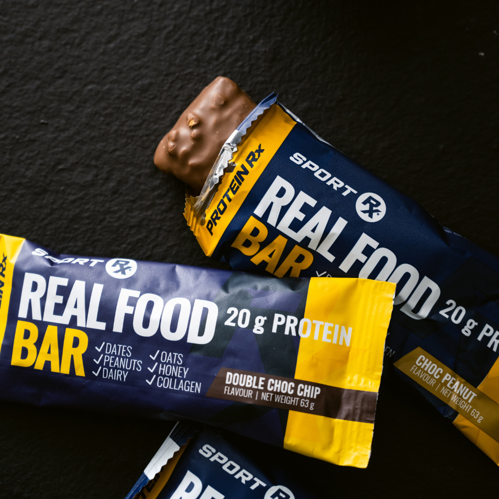 Sport RX Real Food Protein Bar packaging on a dark background