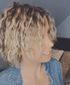 Woman_With_Curly_Hair_Facing_Away_From_Camera